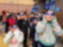 Students looking up during the solar eclipse with special goggles in front of the school.