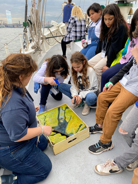 Students on a field trip on a ship in NY Harbor.