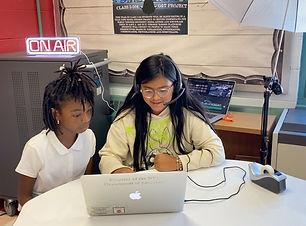 Two students working on a computer